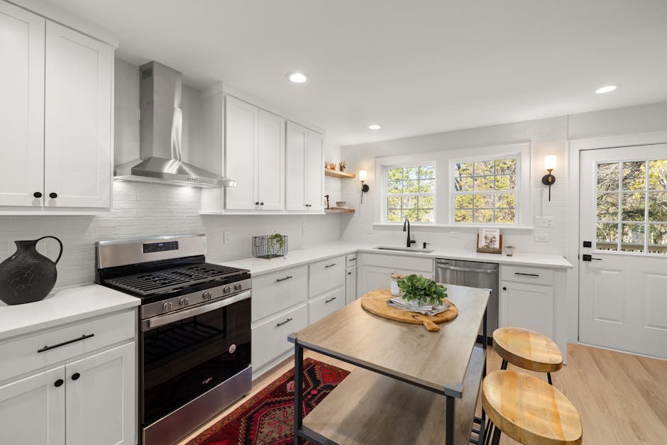 Bright contemporary kitchen with stainless steel appliances and a central island.