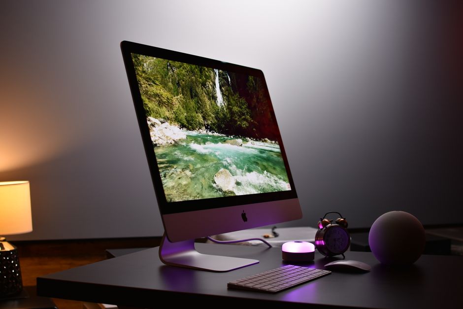 Stylish indoor workspace featuring a sleek desktop computer setup with accessories, ideal for productivity.